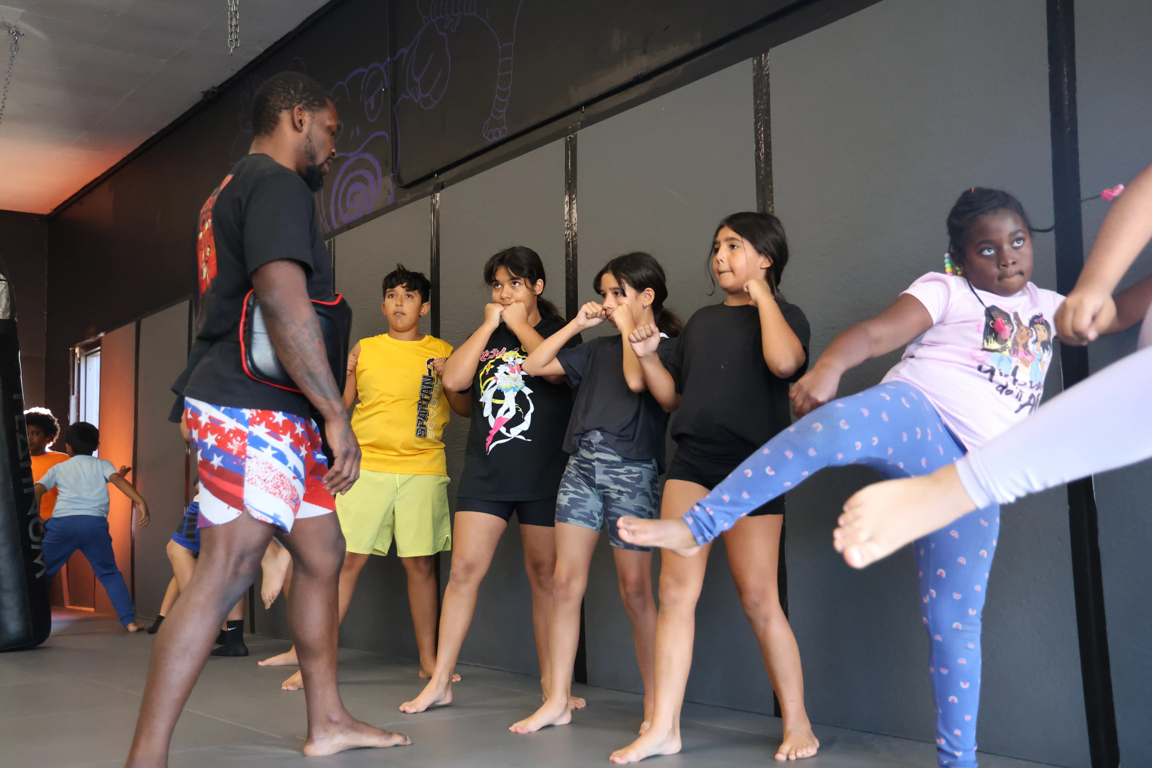 Youth martial arts students training boxing