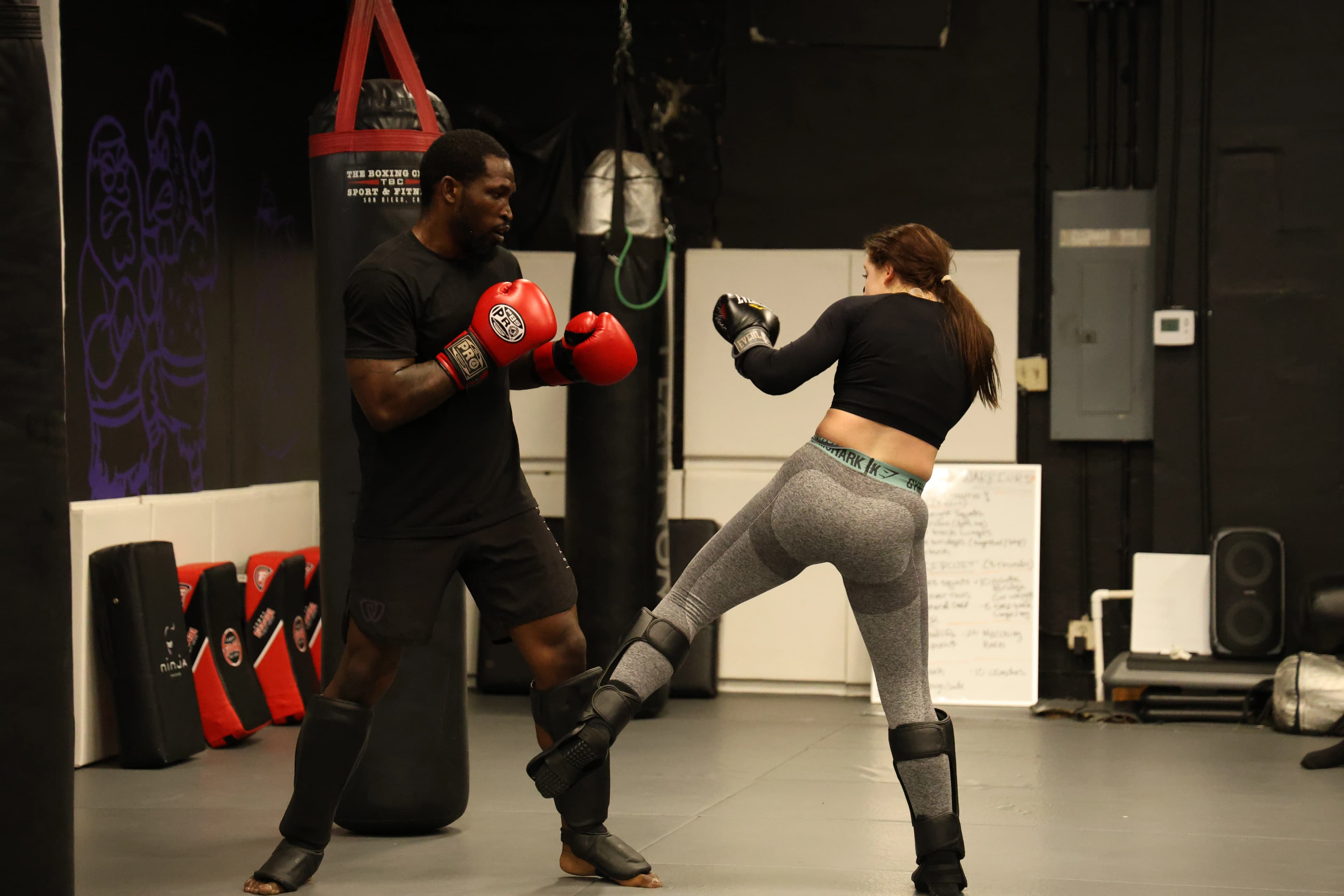 Kickboxing striking drills during class