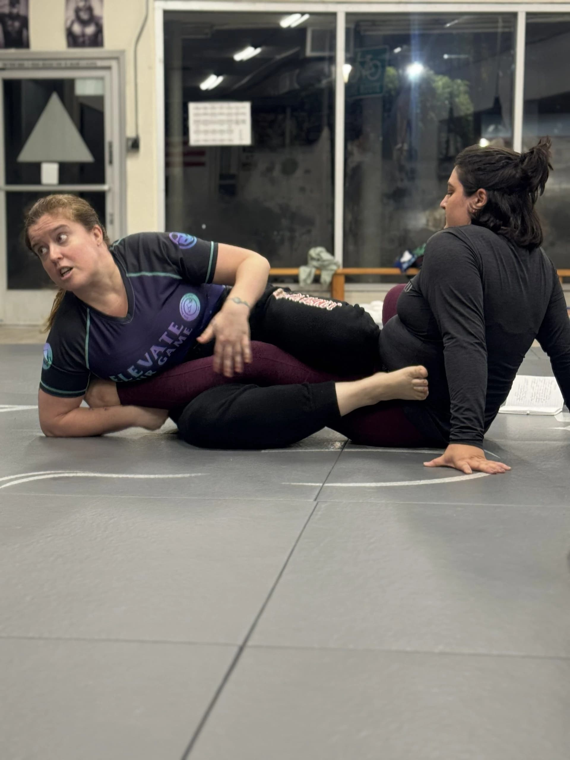 Women training self-defense and Jiu-Jitsu techniques